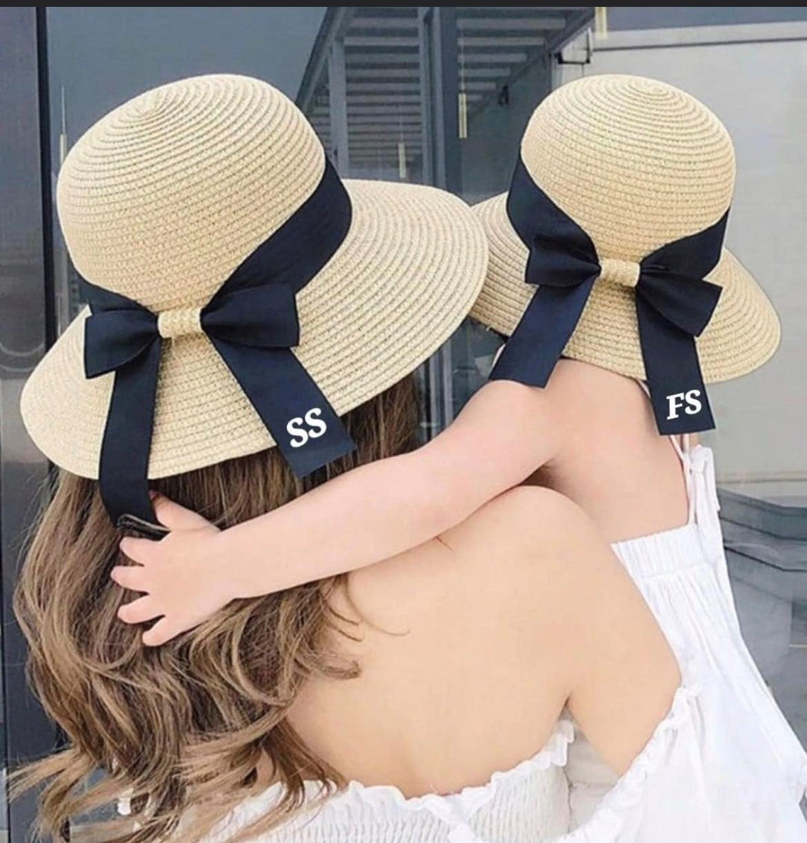 Children's straw hat with black ribbon